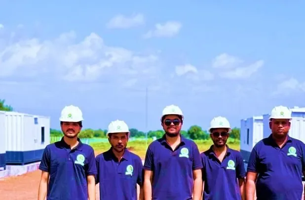 Greentech team in hard hats on site